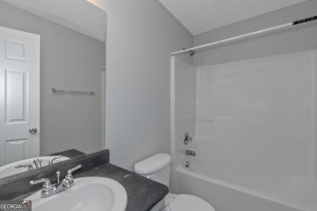 full bathroom with vanity, bathtub / shower combination, and toilet