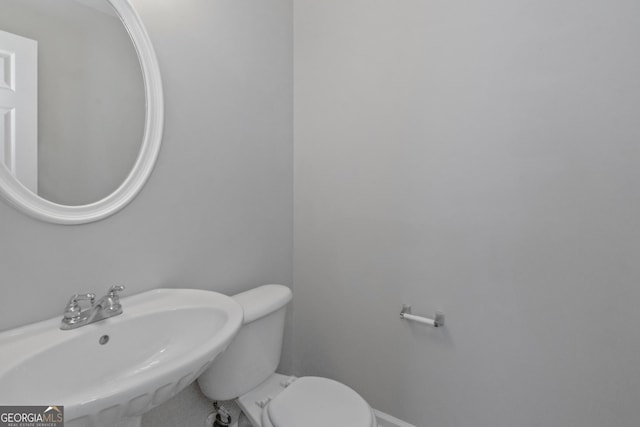 bathroom with sink and toilet