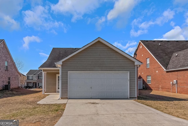 view of front of home with a garage and a front yard