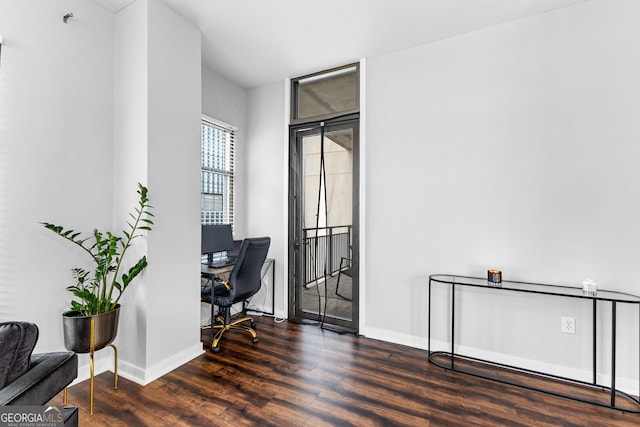 office area with baseboards and wood finished floors