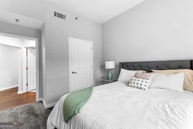 bedroom with carpet, baseboards, and visible vents