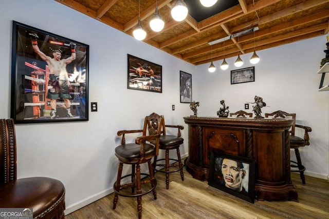 bar with wooden ceiling, wood finished floors, beam ceiling, and baseboards