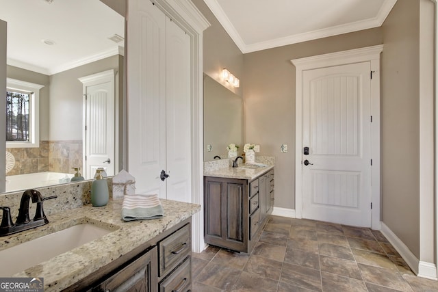 bathroom featuring vanity, ornamental molding, and a tub to relax in