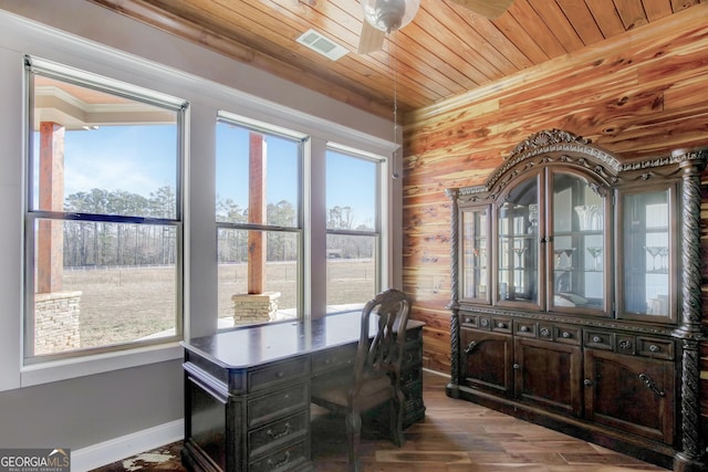 office featuring ceiling fan, wood-type flooring, wooden ceiling, and a healthy amount of sunlight