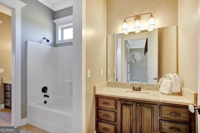 bathroom with shower / bathing tub combination, vanity, ornamental molding, and tile patterned floors