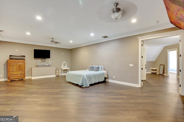 bedroom with crown molding and hardwood / wood-style flooring