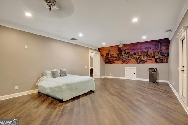 bedroom with hardwood / wood-style flooring and ornamental molding