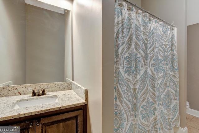 bathroom featuring vanity and tile patterned flooring