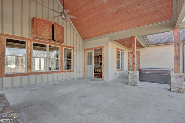 interior space featuring a hot tub and ceiling fan