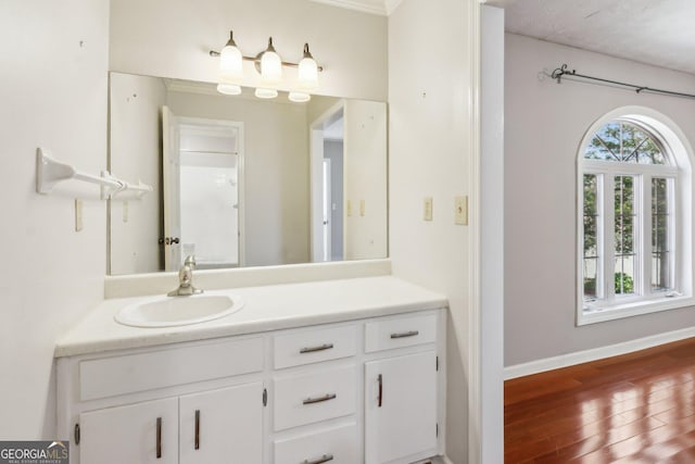 bathroom with vanity and hardwood / wood-style floors