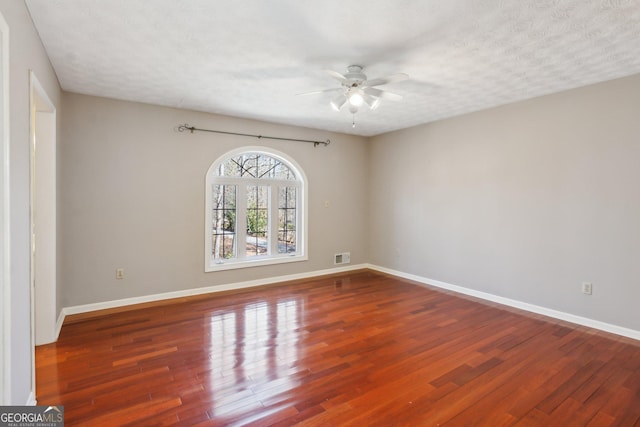 213 Pine Crest Dr, Cumming, GA 30040 - spare room featuring ceiling fan, wood finished floors, and a textured ceiling
