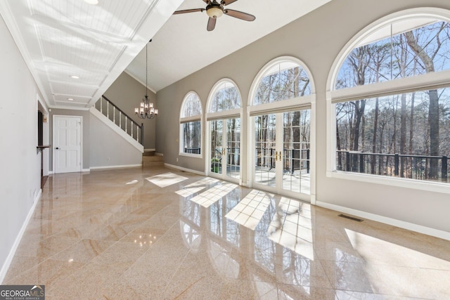 213 Pine Crest Dr, Cumming, GA 30040 - unfurnished living room featuring granite tiled floors, ceiling fan, a chandelier, a high ceiling, and recessed lighting