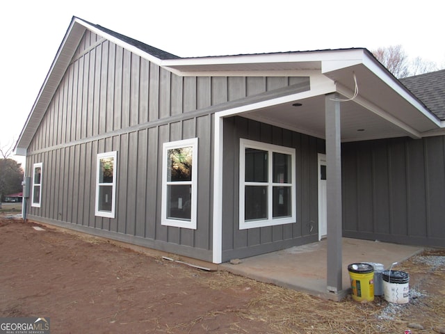 view of side of property featuring a patio