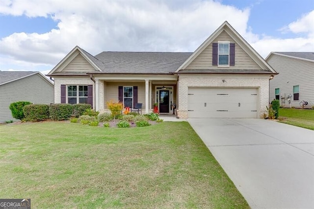 craftsman house featuring a garage, a front lawn, and a porch