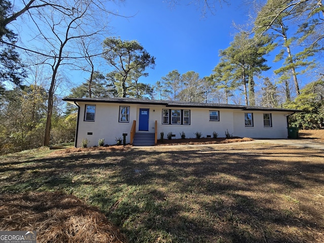 single story home featuring a front yard