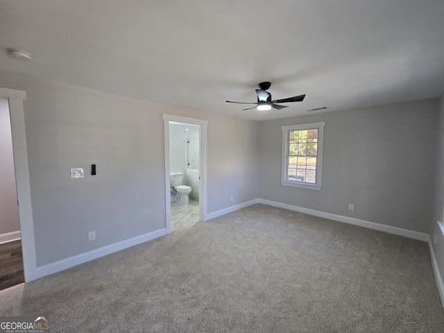 unfurnished bedroom featuring carpet flooring, connected bathroom, and ceiling fan