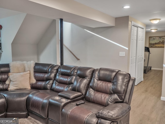 cinema with recessed lighting, light wood-style flooring, and baseboards