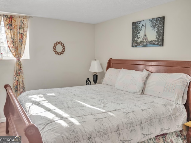 bedroom featuring a textured ceiling