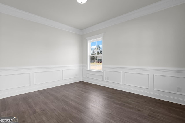 spare room with dark wood-style floors and ornamental molding