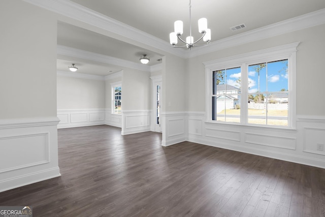 unfurnished dining area with a chandelier, visible vents, ornamental molding, and dark wood-style flooring