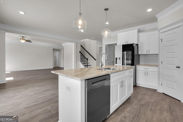 kitchen featuring a sink, wood finished floors, crown molding, and stainless steel dishwasher