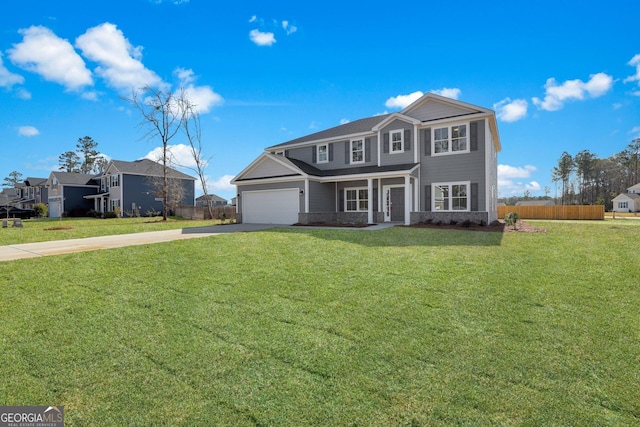 traditional home featuring a garage, concrete driveway, a front lawn, and fence