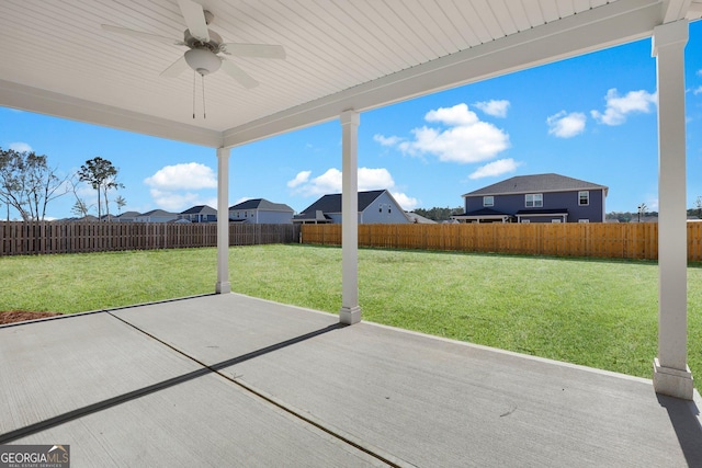 view of patio with a fenced backyard and a ceiling fan