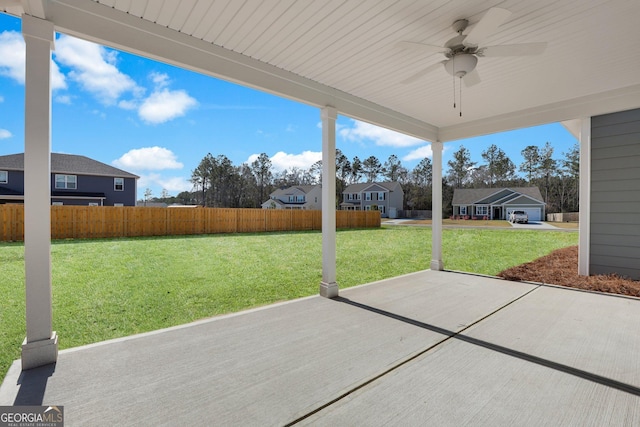 view of patio with a residential view, a ceiling fan, and fence