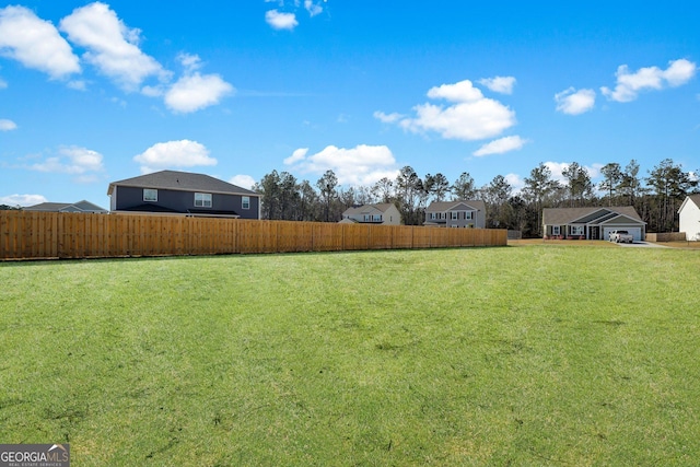 view of yard with fence