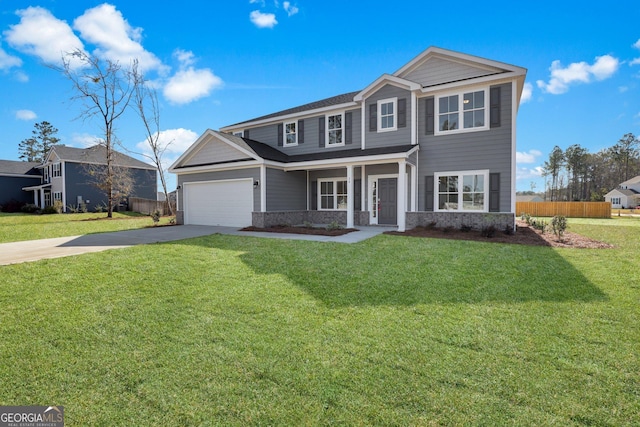 view of front of property featuring a garage, concrete driveway, a front yard, and fence