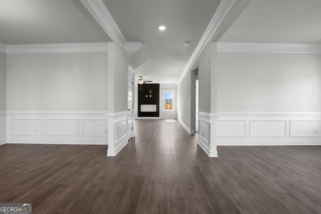 foyer with crown molding, dark wood finished floors, recessed lighting, a fireplace, and a ceiling fan