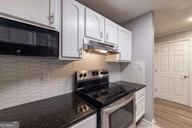 kitchen featuring white cabinetry, dark stone countertops, and stainless steel range with electric cooktop