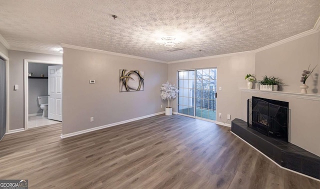 unfurnished living room with crown molding, hardwood / wood-style flooring, and a textured ceiling