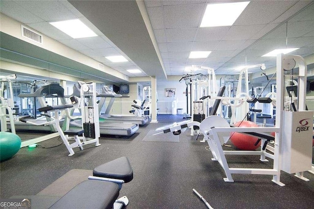 exercise room with a drop ceiling