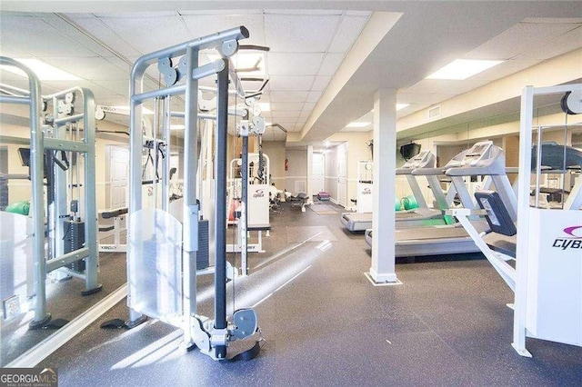 gym featuring a paneled ceiling