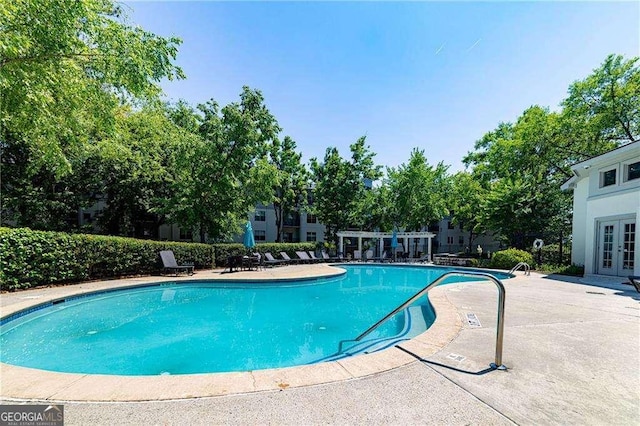 view of pool featuring a pergola and a patio area