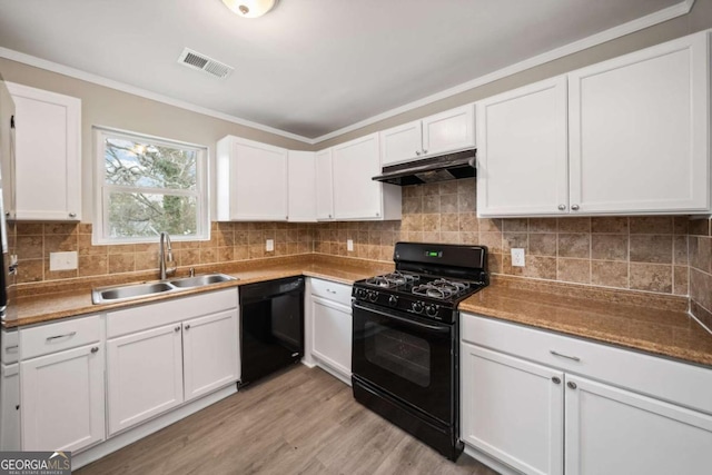 kitchen with white cabinetry, sink, and black appliances