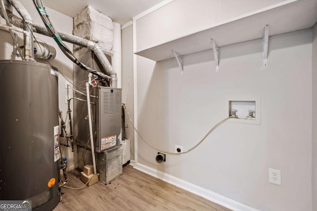 utility room with gas water heater