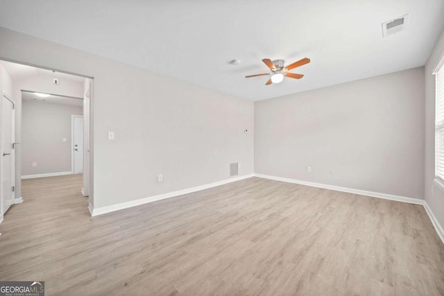 empty room with ceiling fan and light wood-type flooring