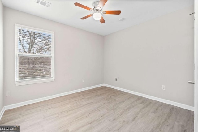 unfurnished room featuring ceiling fan and light wood-type flooring