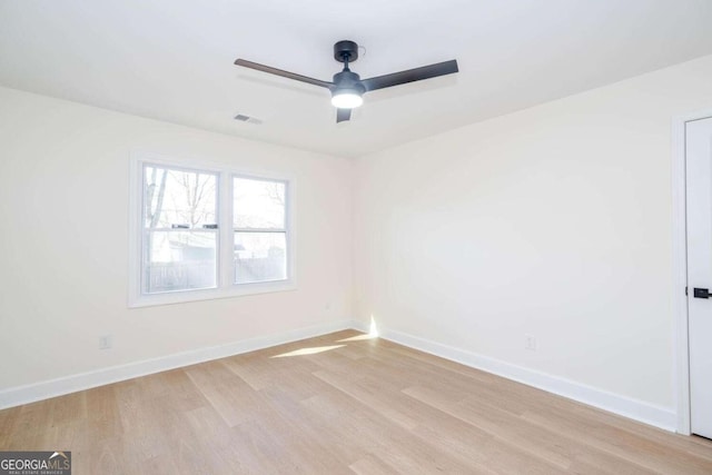 spare room with ceiling fan and light hardwood / wood-style flooring