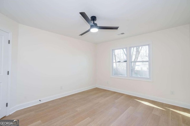 unfurnished room featuring ceiling fan and light hardwood / wood-style floors