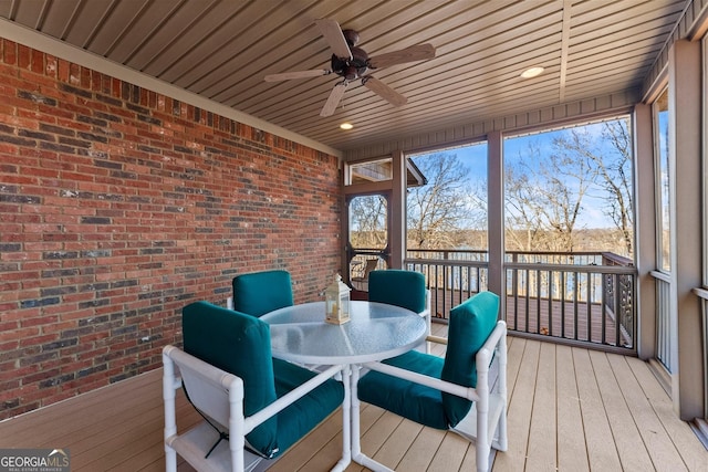 sunroom with wood ceiling and ceiling fan