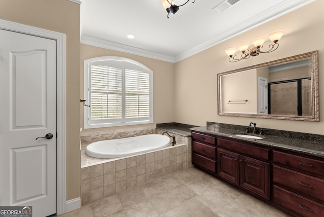 bathroom featuring ornamental molding, a relaxing tiled tub, and vanity