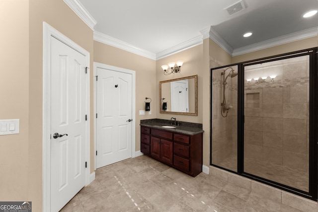 bathroom featuring vanity, crown molding, and a shower with door
