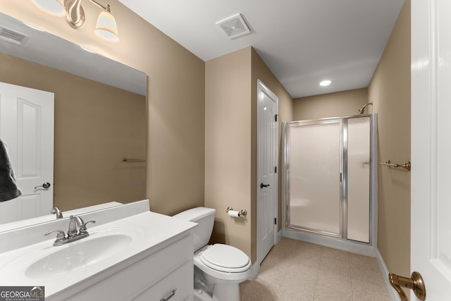bathroom with vanity, toilet, and walk in shower