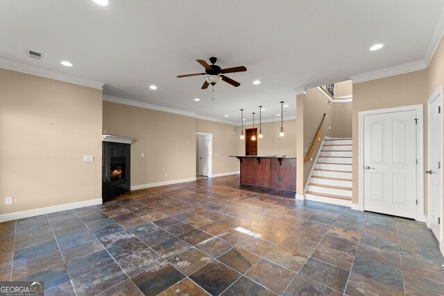 unfurnished living room featuring crown molding and ceiling fan