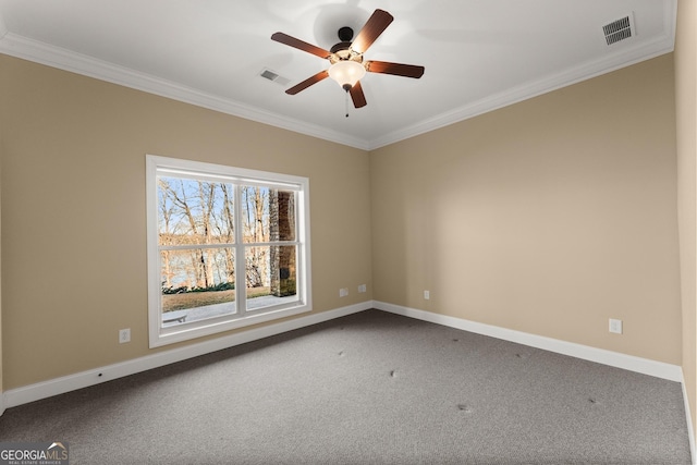 carpeted spare room with crown molding and ceiling fan