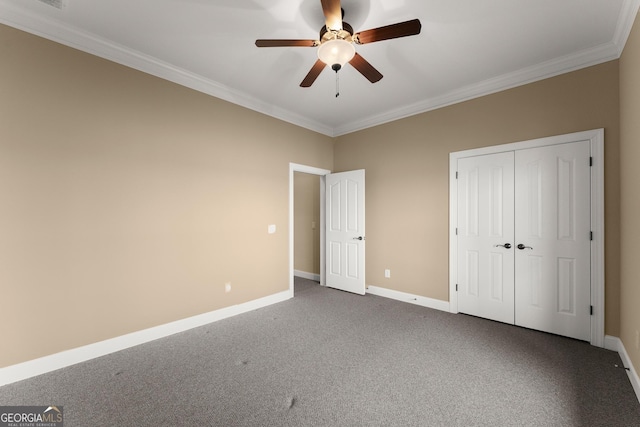 unfurnished bedroom with carpet floors, ornamental molding, a closet, and ceiling fan