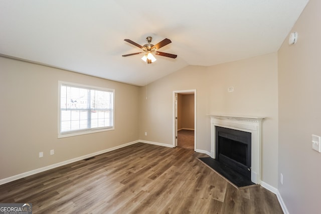 unfurnished living room with lofted ceiling, dark hardwood / wood-style floors, and ceiling fan